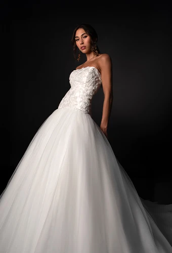 Bride wearing strapless tulle ballgown with sparkling lace bodice