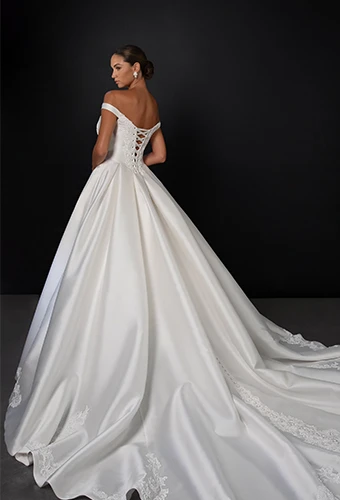 Bride wearing ballgown wedding dress with off-the-shoulder straps
