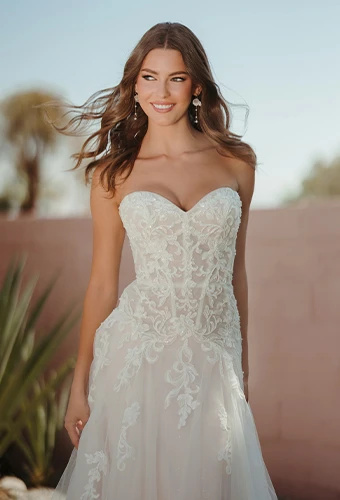 Bride wearing strapless wedding dress with sweetheart neckline and drop waist