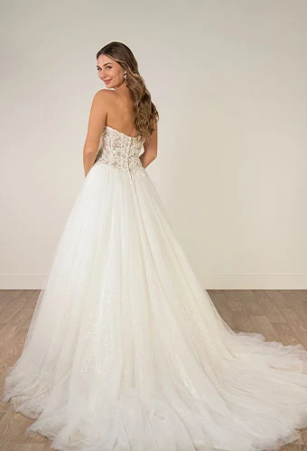 Bride wearing strapless a-line wedding dress with lace appliques and tulle skirt