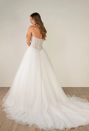 Bride wearing strapless ballgown wedding dress with beaded corset