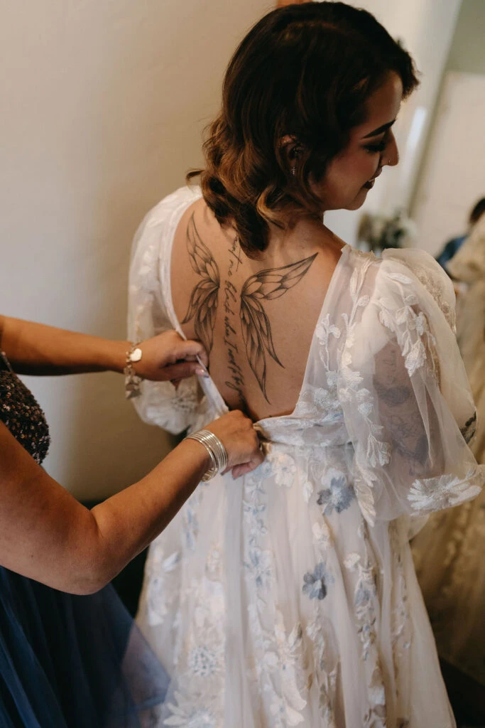 True bride Aliza posing in her wedding gown