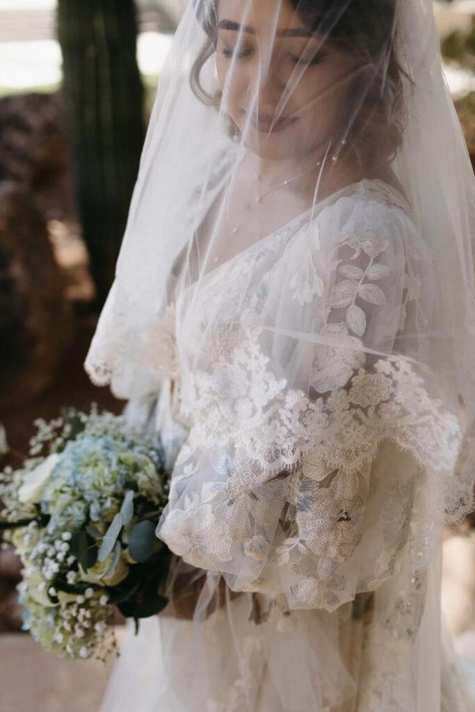 True bride Aliza posing in her wedding gown