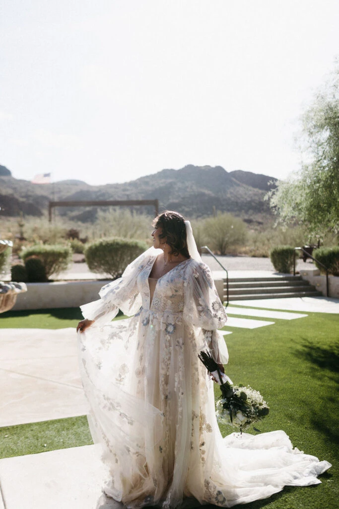 True bride Aliza posing in her wedding gown