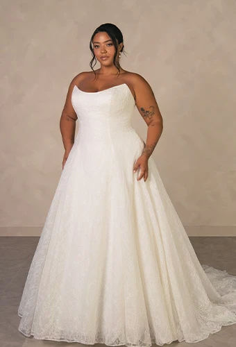 Plus size bride wearing strapless a-line wedding gown with allover lace and sweetheart neckline