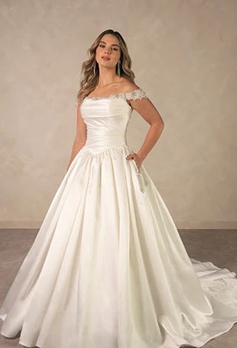 Bride wearing satin ballgown wedding dress with crystal neckline and off-the-shoulder straps