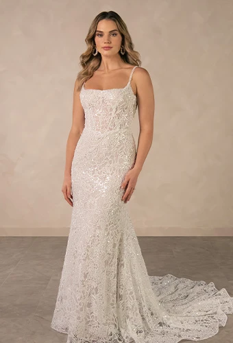 Bride wearing lace sheath wedding dress with square neckline and beaded spaghetti straps