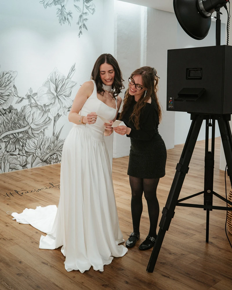 Bride and stylist looking at photos