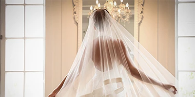 bride twirling in her ribbon lined veil