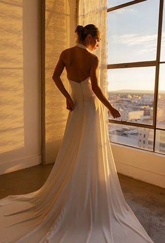 Bride wearing simple halter wedding dress with scoop neckline