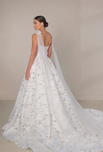 Bride wearing strapless wedding dress with all over graphic lace