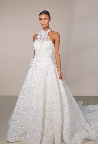 Bride wearing lace wedding dress with halter neckline