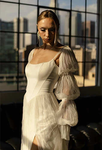 Bride wearing boho wedding gown with statement sleeves