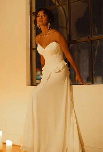 Bride wearing strapless boho wedding dress with sweetheart neckline