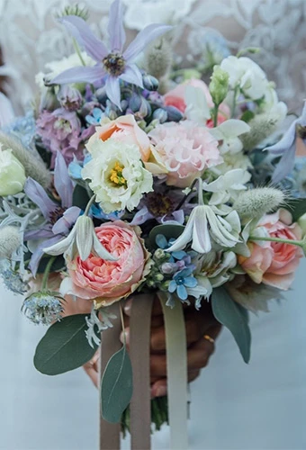 Early summer bridal bouquet with peonies, cosmos and hydrangeas
