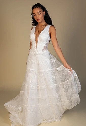 Bride wearing plunging v-neck lace and tulle a-line wedding dress