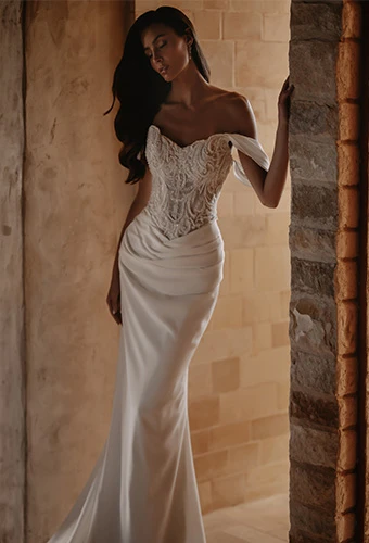 Bride wearing lace and crepe column wedding gown