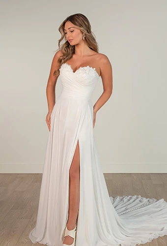 Bride wearing a floral sweatheart neckline a-line wedding dress with high leg slit