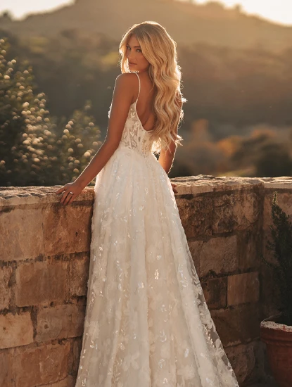 bride looking over shoulder in sparkling lace a-line wedding dress