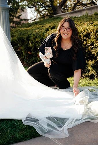 Wedding Content Creator fixing a brides dress