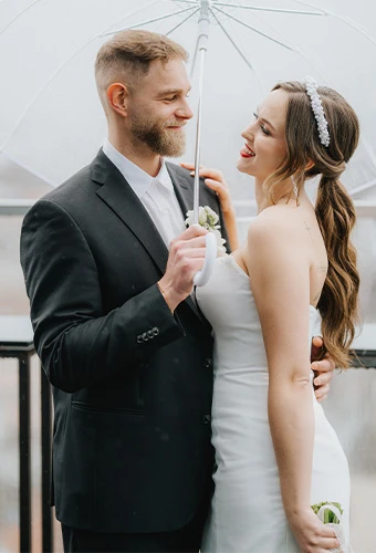 Bride wearing Essense of Australia D3957, a strapless short mini wedding gown, featuring a headband