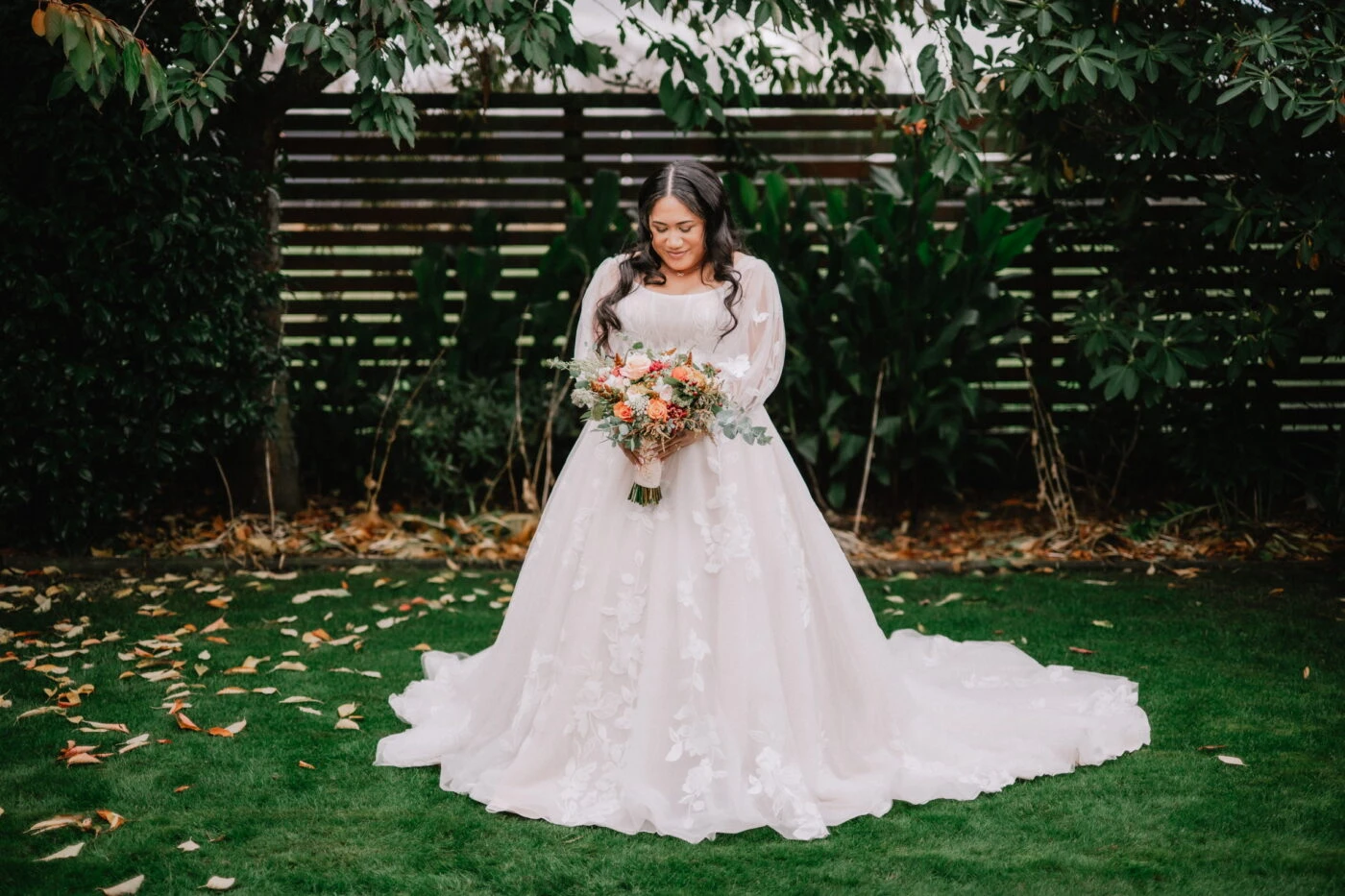 True bride Kuini posing in her wedding gown
