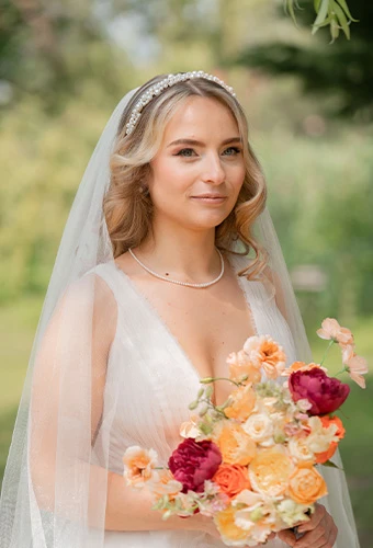 Bride wearing Martina Liana style 1531, a ethereal couture ballgown, featuring a pearl necklace
