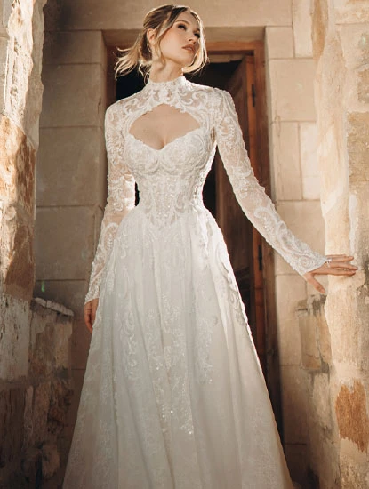 bride wearing lace long sleeve a-line wedding dress with front keyhole