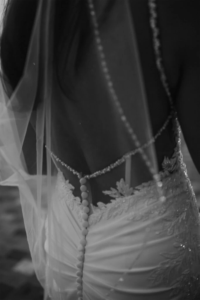 True Bride April showing off the back of her wedding dress, Martina Liana Style 1798