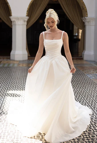 Bride wearing Essense of Australia style D4484, a square neckline a-line wedding dress with draped bodice