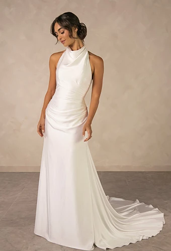 Bride wearing simple sheath wedding dress with high halter neckline