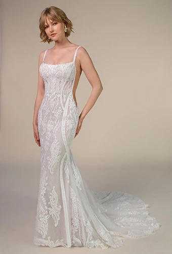 Bride wearing All Who Wander esra, a boho fit-and-flare wedding dress with open back