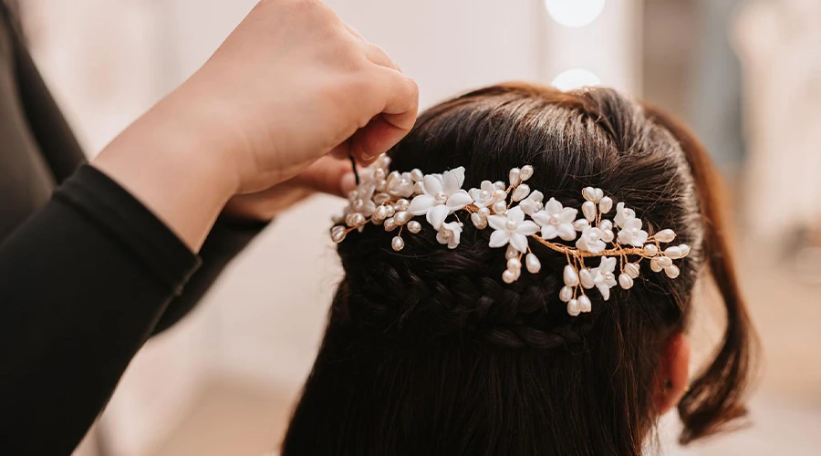 Bride getting her hair done for her wedding