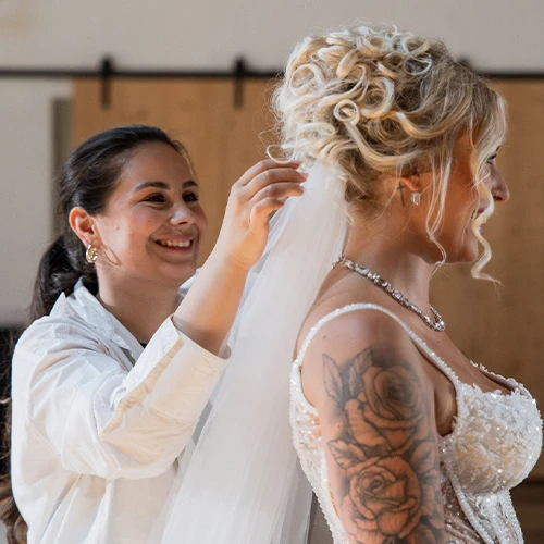 Bride getting her veil put on