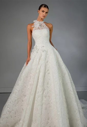 Bride wearing Martina Liana Luxe style LE1475, a lace and tulle a-line wedding gown with high neck