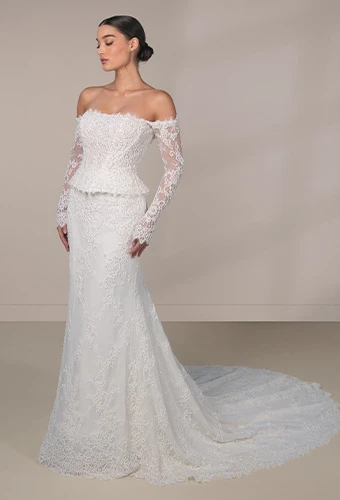 Bride wearing Martina Liana Luxe style LE1490, an off-the-shoulder beaded lace and tulle wedding gown with peplum