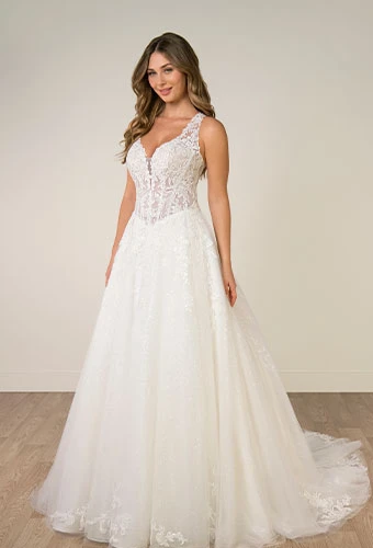 Bride wearing lace a line wedding dress with v neckline and shoulder straps