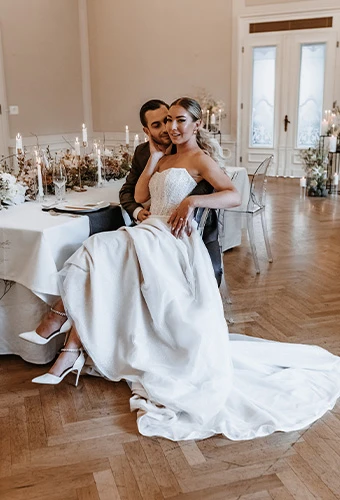Bride posing with her husband