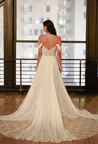 flowy boho wedding dress with off the shoulder sleeves and lace train - dune by all who wander