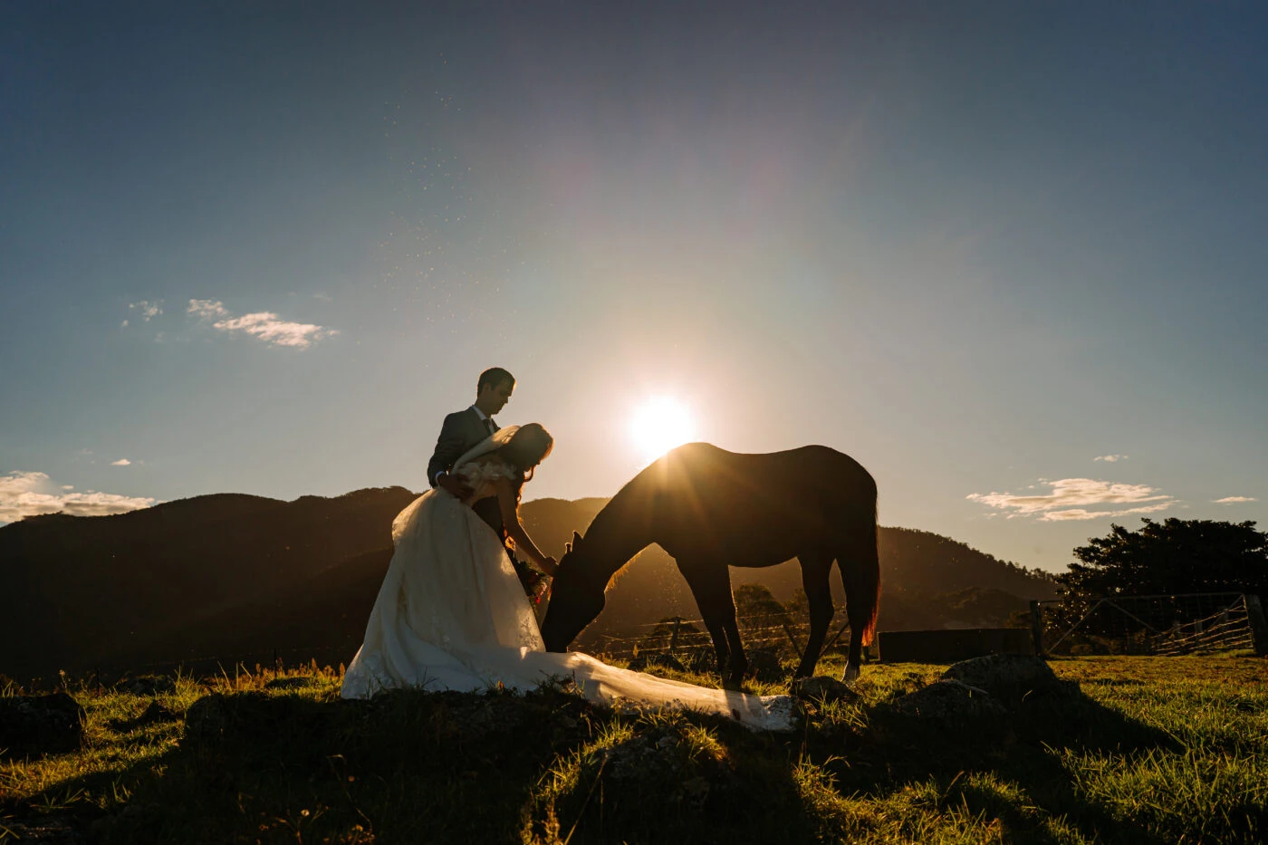 true bride Jess posing with a horse and her husband