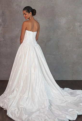 Bride wearing strapless ballgown wedding dress with bubble hem