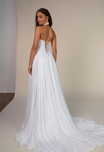 Bride wearing strapless simple wedding gown with lace up back