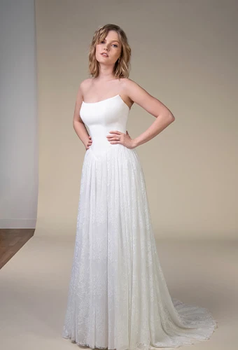 Bride wearing simple strapless wedding gown with scoop neckline