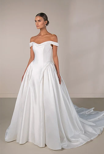 Bride wearing simple ballgown wedding dress with off the shoulder straps