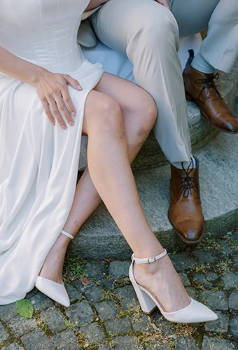 bride posing with her husband