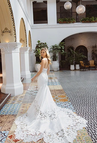 Bride wearing fit-and-flare wedding dress with sheer lace cathedral train, Essense of Australia d4600