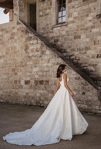 Bride wearing voluminous A-line wedding gown with cathedral train, Martina Liana ml2036
