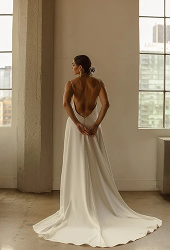 Bride wearing simple wedding dress with open back and chapel train, All Who Wander rianna