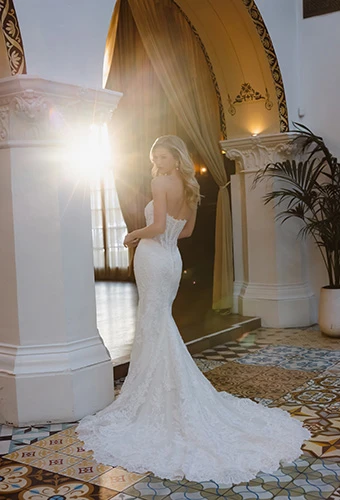 Bride wearing strapless lace wedding dress with floral chapel train, Essense of Australia d4541