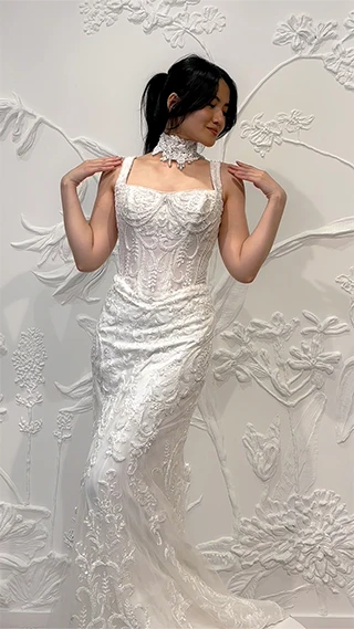 bride posing in sexy lace fit-and-flare wedding dress